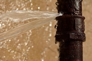 bigstock-Rusty-burst-pipe-leaking-water-109170257.jpg