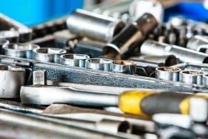 Assortment Kit Of Adjustable Metallic Tools In Mechanic Garage