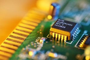 Electronic chip on circuit board. Macro close-up, shallow DOF.
