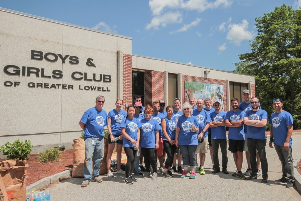 Setra associates pose in front of the Boys & Girls Club of Greater Lowell.