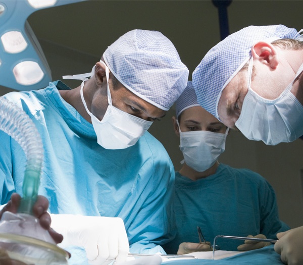 Surgeons in a hopsital operating room.