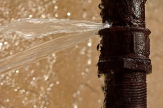 bigstock-Rusty-burst-pipe-leaking-water-109170257.jpg