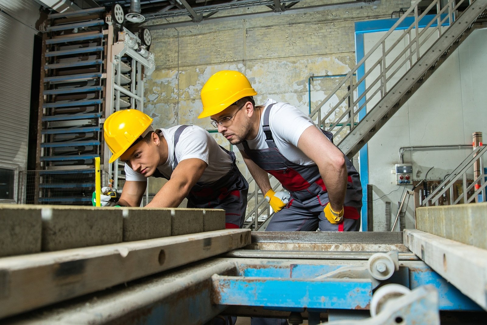 bigstock-Worker-and-foreman-in-a-safety-64077790